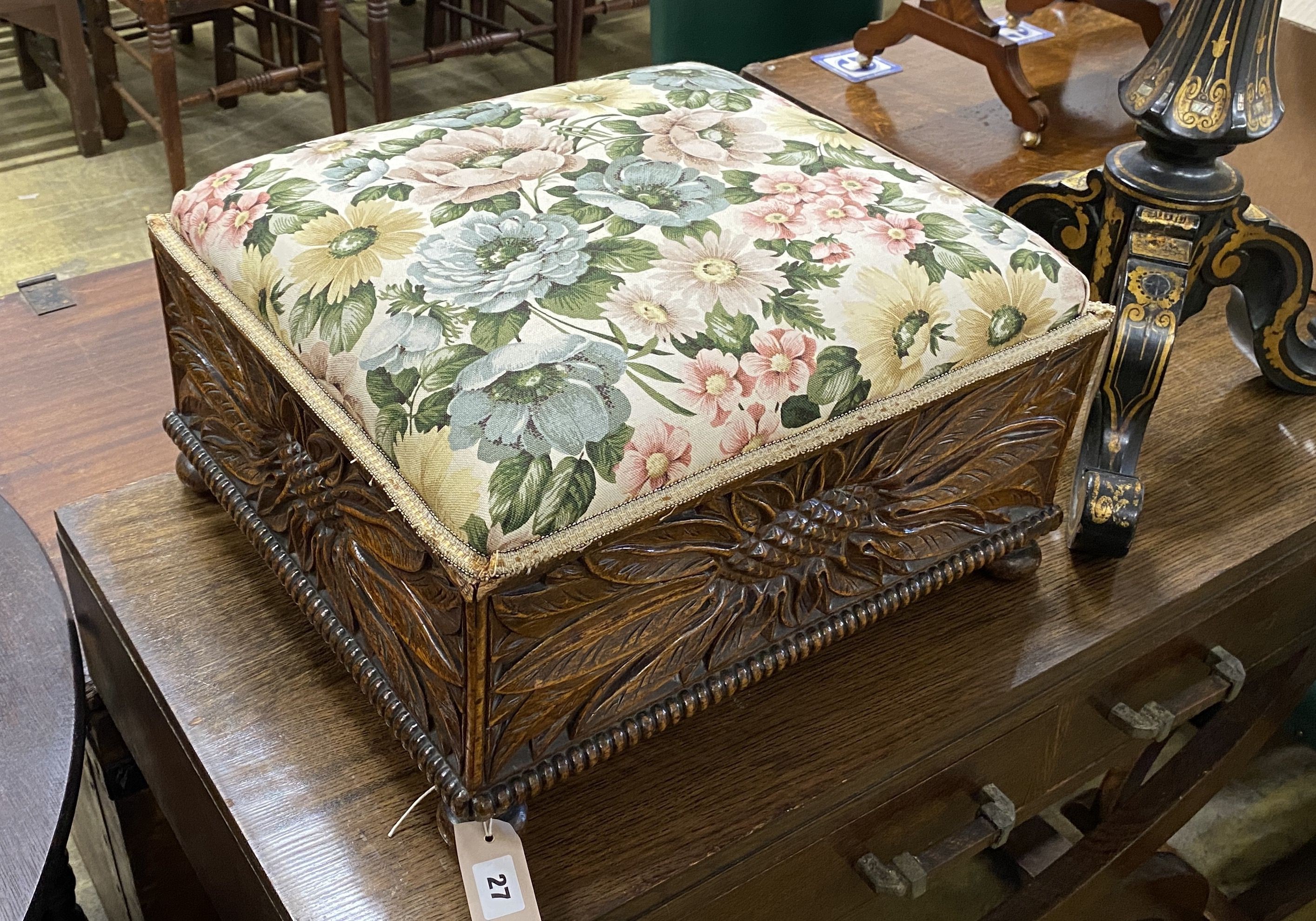 An early 20th century rectangular carved oak footstool, length 46cm, depth 42cm, height 26cm